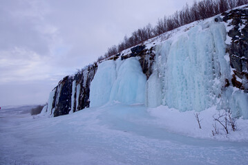 Large frozen waterfall in Abisko National Park, Abisko, Sweden