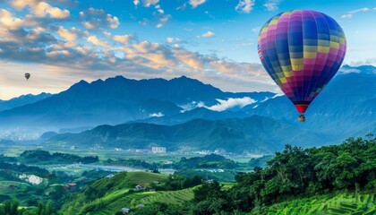 Fototapeta premium Vibrant Hot Air Balloon Soars over Spectacular Mountain Views at Cingjing Farm, Nantou, Taiwan