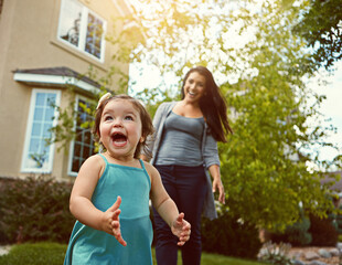 Excited, toddler and mother outdoor in backyard for play, fun and adventure on summer weekend....