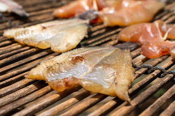Sun-dried fish on bamboo basket