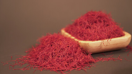 Saffron threads in a small bowl, poured around the bowl