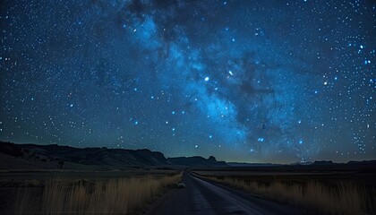 Stunning night sky filled with stars and the Milky Way galaxy over a quiet country road. Perfect for astronomy enthusiasts and nature lovers.