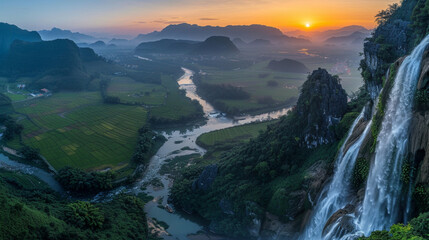 Aerial view of dawn breaking over a mountain in Ngoc Con Ward, Cao Bang Province, Vietnam, with river, rice fields, and Ban Gioc Waterfall