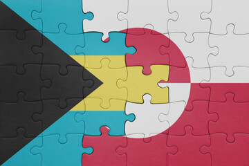 puzzle with the colourful national flag of greenland and flag of bahamas.