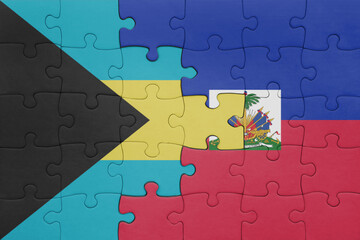 puzzle with the colourful national flag of haiti and flag of bahamas.