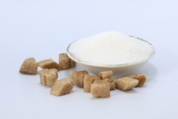 bowl of white sugar and brown sugar on white background
