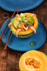 Fruit salad with melon and shrimp.