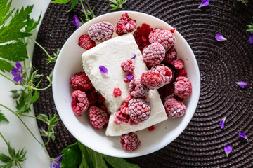 Vanilla ice cream with raspberries