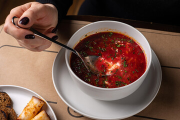 Ukrainian dish.  Borscht with meat and sour cream.