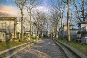 Paris, the Pere-Lachaise cemetery, cobbled alley with graves 
