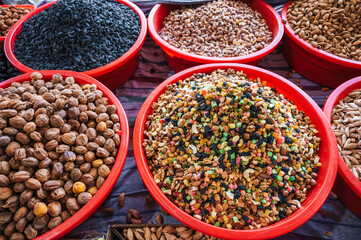 various varieties of nuts, dried fruits, oriental sweets on the counter in the Asian uzbek market