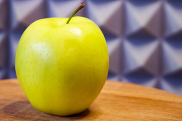 Vibrant apple on a patterned backdrop, great for healthy lifestyle promotion.