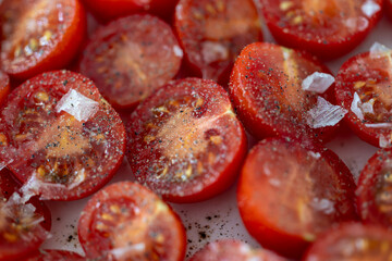 Sliced cherry tomatoes with sea salt.