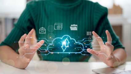 A woman is holding a cloud with a blue arrow pointing up. Concept of growth and progress, as the cloud is rising upwards. The woman's hands are spread out, emphasizing the upward movement of the cloud