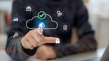 Fototapeta premium Women touch the cloud symbol displayed on the device connection and use an advanced cloud technology system for optimal management of storage resources. Fast digital work. cloud technology concept