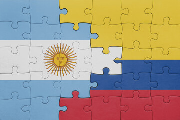 puzzle with the colourful national flag of colombia and flag of argentina.