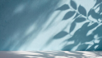 Obraz premium light background of shadows from plant leaves on a delicate light blue wall, minimalistic background for the presentation of your products, stock wallpaper image template