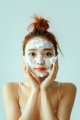 Fototapeta premium Skin care. Asian woman in a facial cleansing routine.