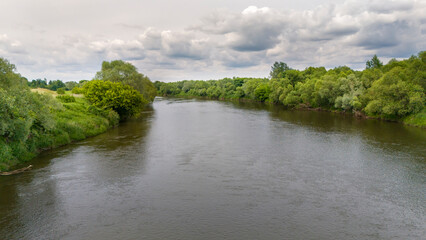 Aerial view of river in summer time. Beautiful natural scenery of river, drone view.