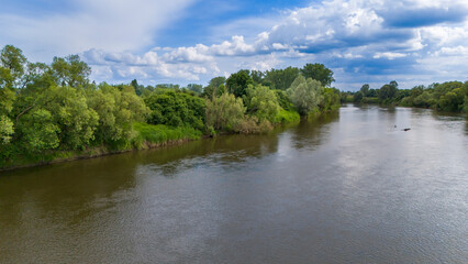 Aerial view of river in summer time. Beautiful natural scenery of river, drone view.