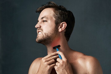 Razor, hurt or man in studio with pain or hair removal for skincare tools, face grooming or...