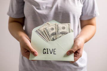 Carefully budgeting her money, she placed cash into separate envelopes for giving, business expenses, and personal finance, ensuring she could pay for everything with ease, straight from her purse.