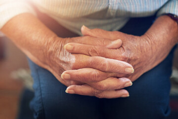 Senior person, hands and prayer for faith, hope and patience for zen in retirement home for elderly...