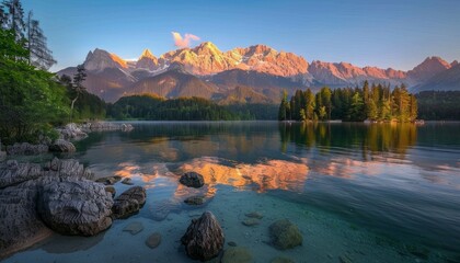 Summer sunrise over Eibsee lake, golden glow Zugspitze mountain range in Bavarian Alps, Germany