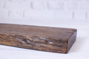Oak kitchen board on the table. On a white background.