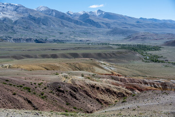 panoramic landscape with unusual red mountains with a Martian view filmed from a drone in Altai in May