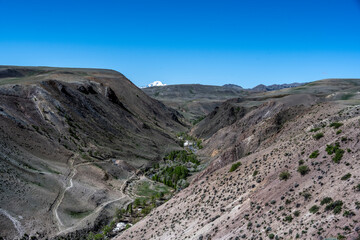 panoramic landscape with unusual red mountains with a Martian view filmed from a drone in Altai in May