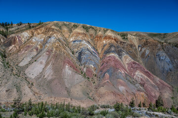 panoramic landscape with unusual red mountains with a Martian view filmed from a drone in Altai in May