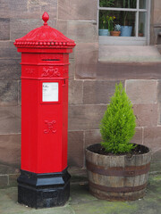 traditional bright red cast iron British Victorian octagonal post or mail box