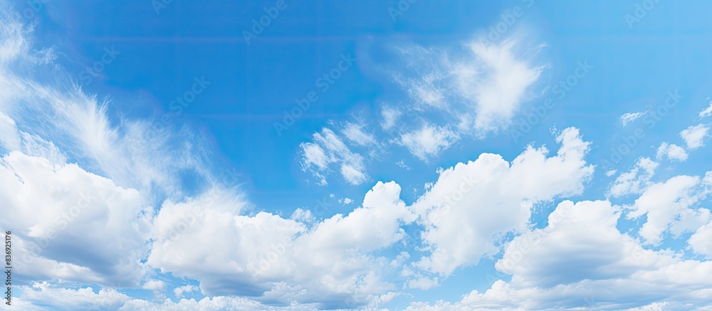 Poster background of a blue sky during the day with cirrus clouds, perfect for copy space image.