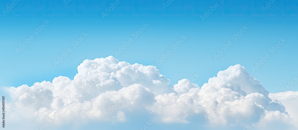Poster the cloud provides a contrasting element against the serene blue sky, offering a visually pleasing c