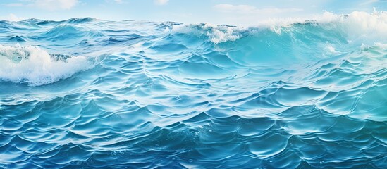 Obraz premium An ocean water background with a sea wave and copy space image.