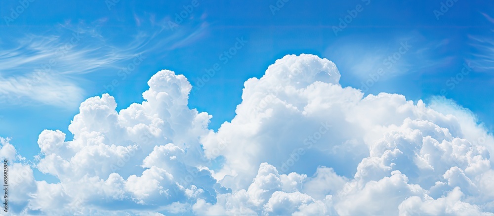 Poster soft focus white clouds against a blue sky background with copy space image.