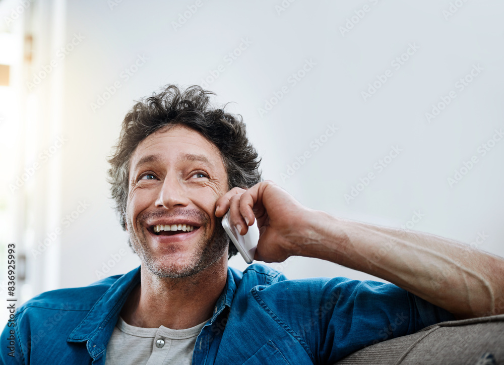 Poster Man, home and happy on sofa with phone call for networking and communication. Living room, couch and smile for good news or conversations with fun, laugh and satisfied with connection to relax