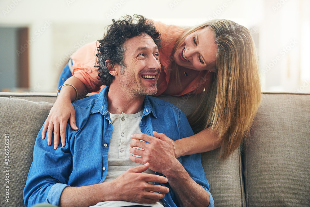 Poster Happy couple, couch and hug in home with love, marriage and romance for man and woman in living room. Sofa, smile or support or solidarity for relationship, relax or trust for commitment and embrace