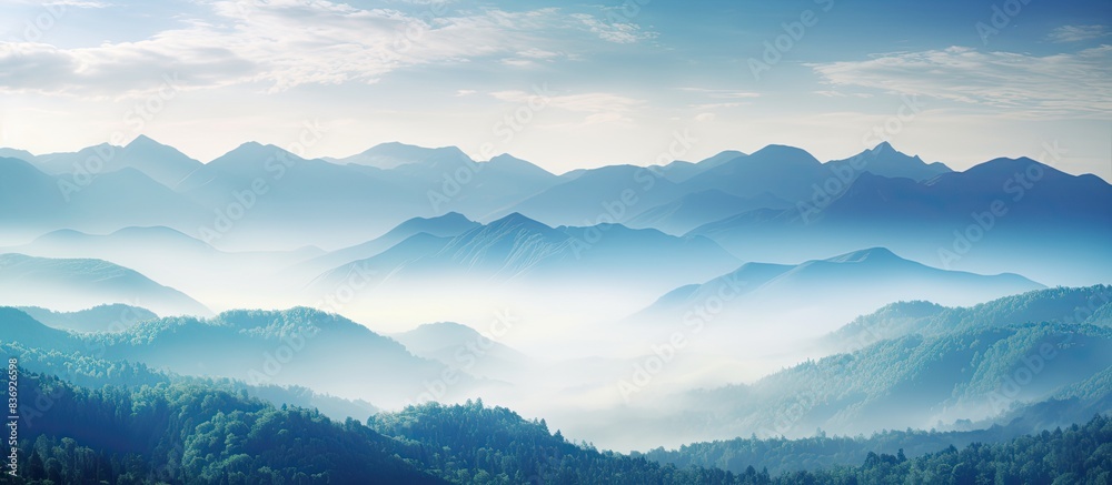 Poster enjoy the breathtaking view of misty mountains in this picturesque landscape with a captivating copy