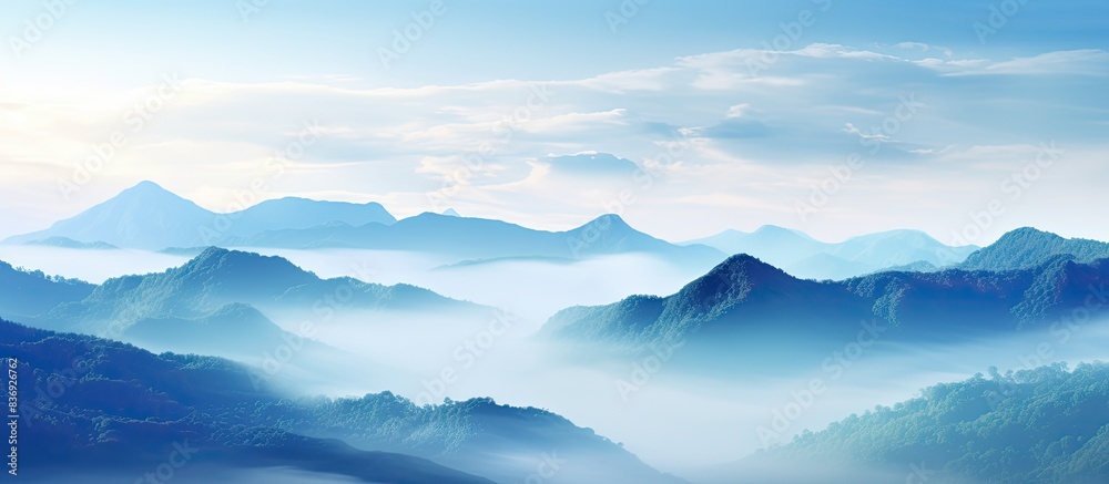 Poster enjoy the breathtaking view of misty mountains in this picturesque landscape with a captivating copy