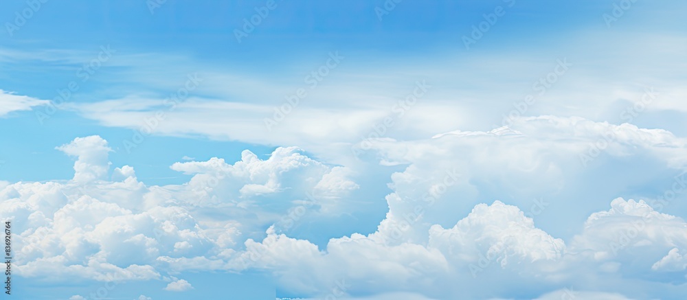 Poster Daytime scenery with a mix of blue sky and overcast gray clouds, featuring a vast copy space image.