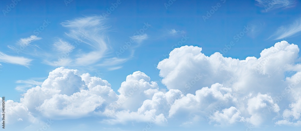 Poster soft focus white clouds against a blue sky background with copy space image.