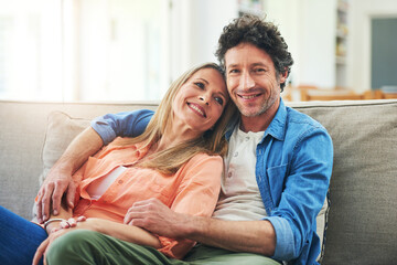 Happy couple, couch and hug in home with love, marriage and romance for man and woman in living...
