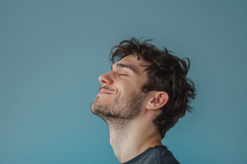 Fototapeta premium A close up of a man with beard and closed eyes looking to a side