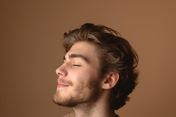 Obraz premium A close up of a man with beard and closed eyes looking to a side