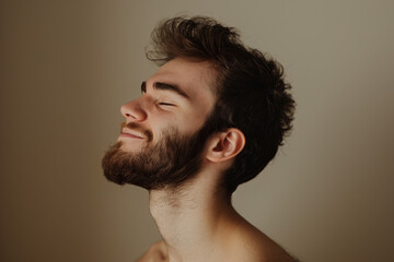 Fototapeta premium A close up of a man with beard and closed eyes looking to a side