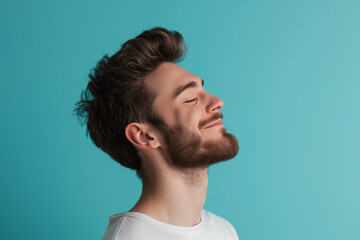 Fototapeta premium A close up of a man with beard and closed eyes looking to a side
