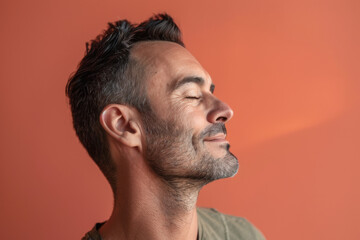 Fototapeta premium A close up of a man with beard and closed eyes looking to a side