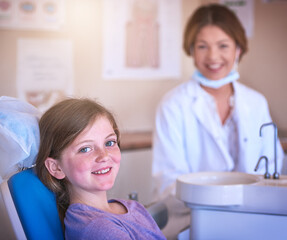 Dentist, child and portrait with doctor for teeth cleaning or cavity treatment for oral hygiene or...